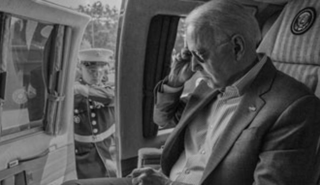 President Biden removing sunglasses aboard Marine One