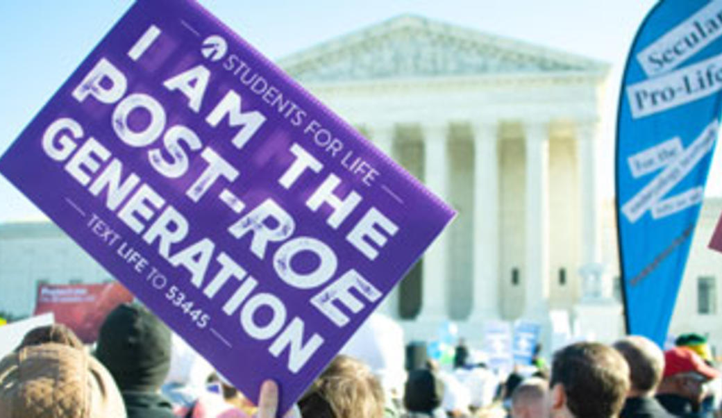 Pro and anti abortion signs in front of the Supreme Court