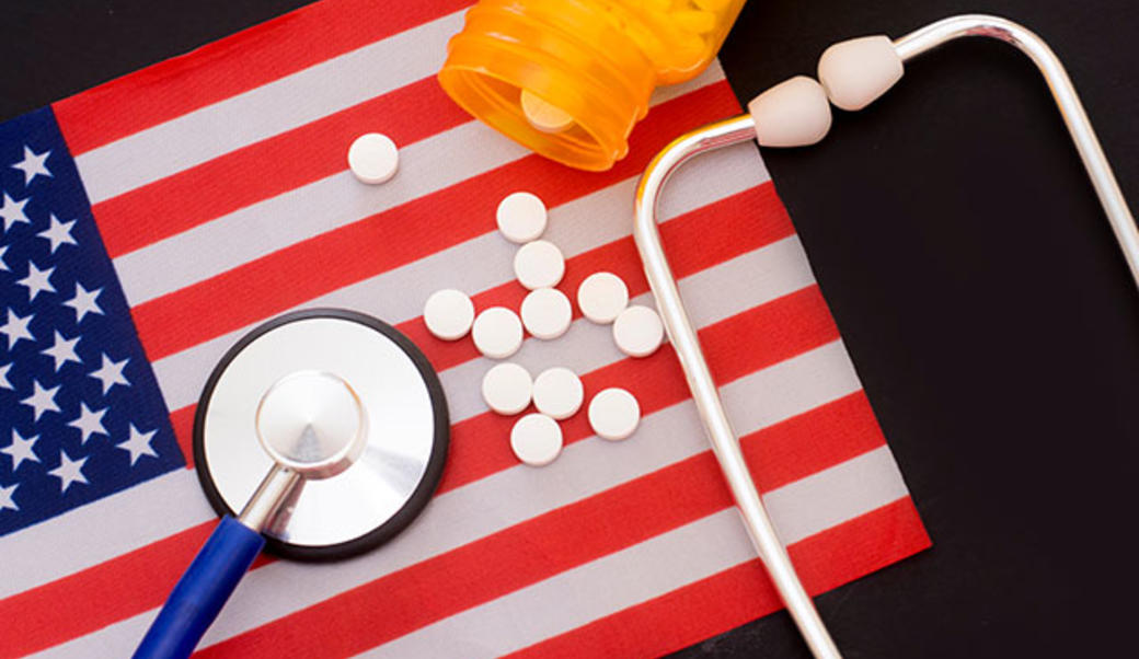 American flag with stethoscope and medicine