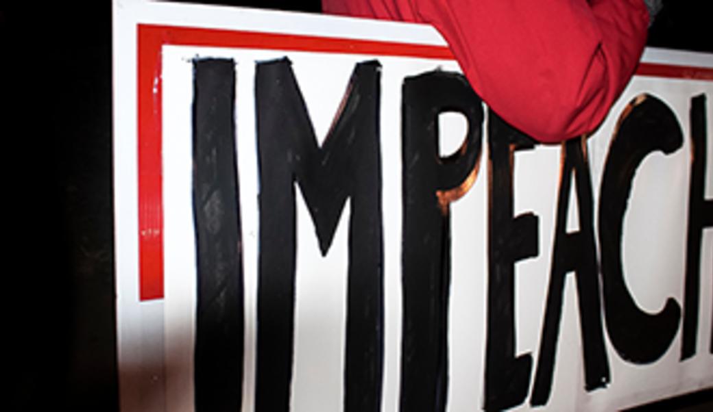 image of protestor's "impeach" sign