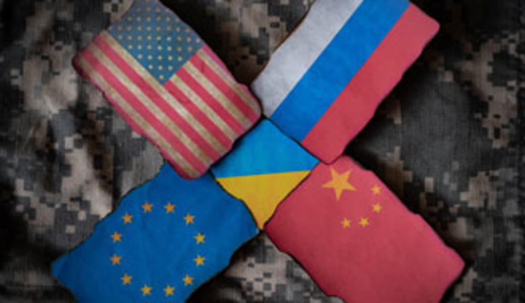 image showing flags of U.S., Russia, China, EU, Ukraine superimposed over camouflage fabric