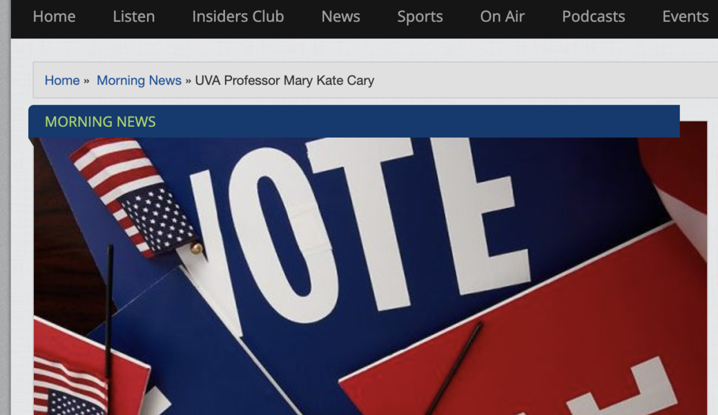 screenshot of article headline and photograph showing signs reading "Vote"