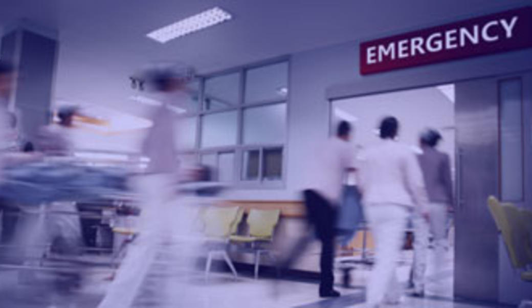 emergency room entrance with blurry human figures