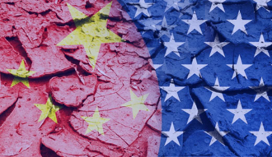 China and US flags superimposed over cracked earth