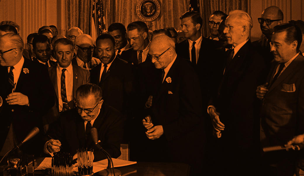 LBJ signs Civil Rights Act