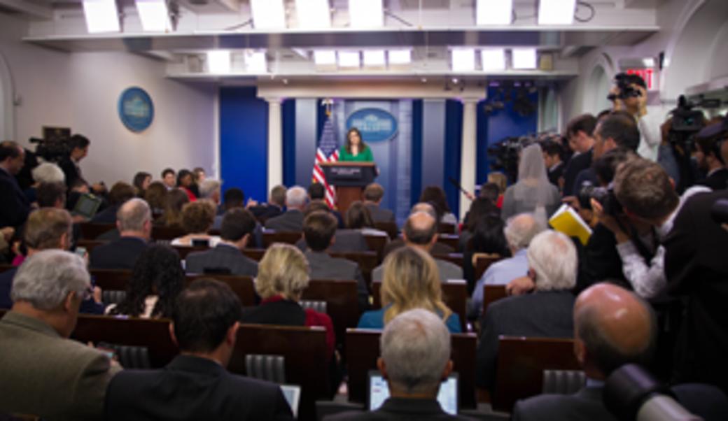 Sarah Huckabee Sanders giving press briefing in 2017