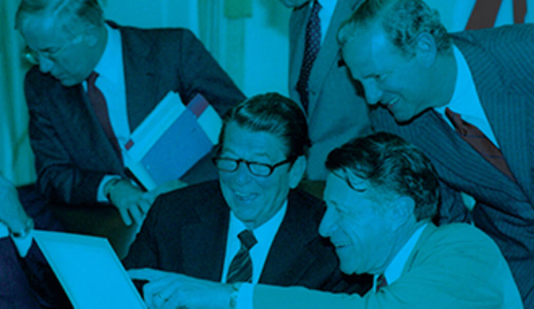 Photo montage of Ronald Reagan with Casper Weinburger and James Baker, with other senior advisors in the background