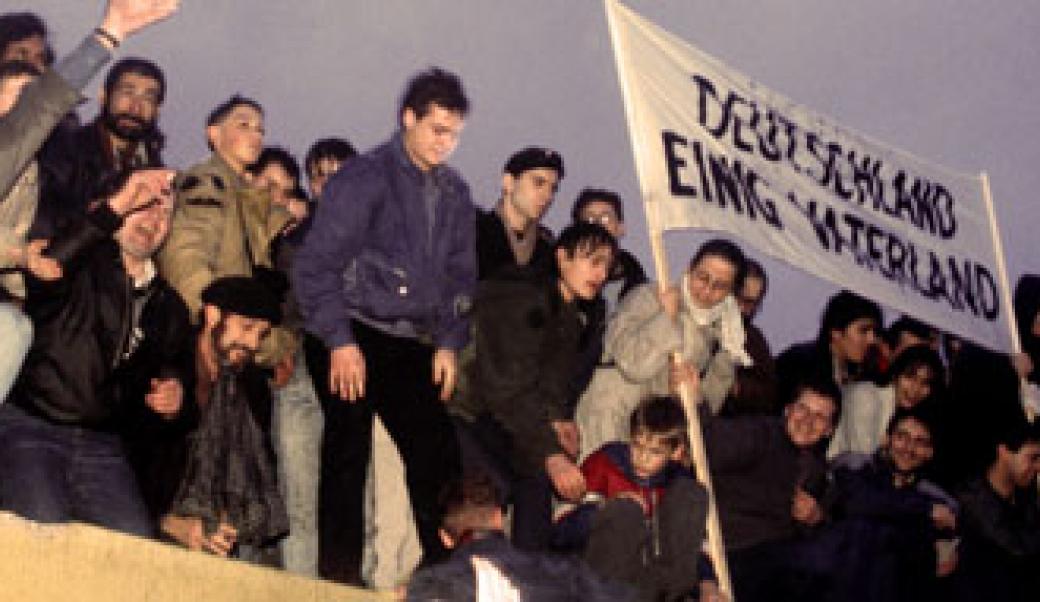 People atop Berlin Wall in 1989