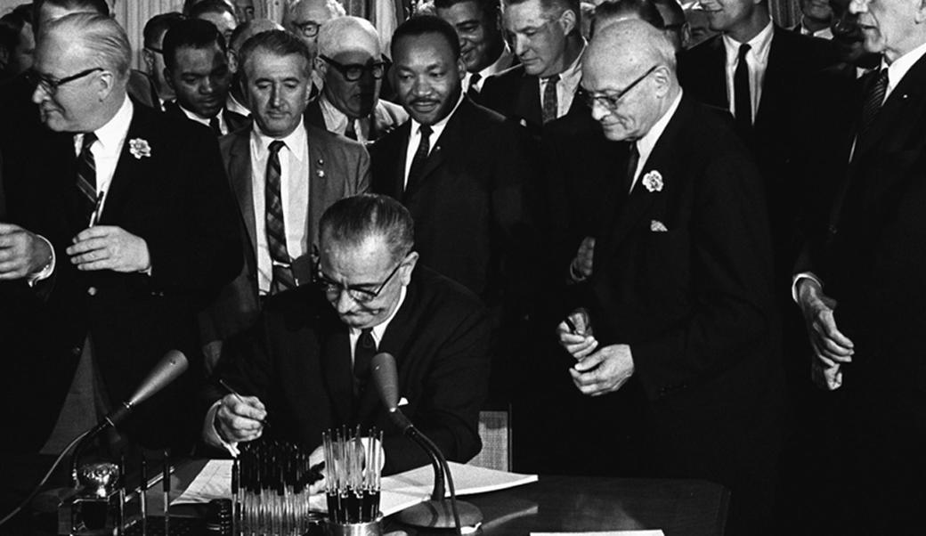 LBJ signs the Civil Rights Act