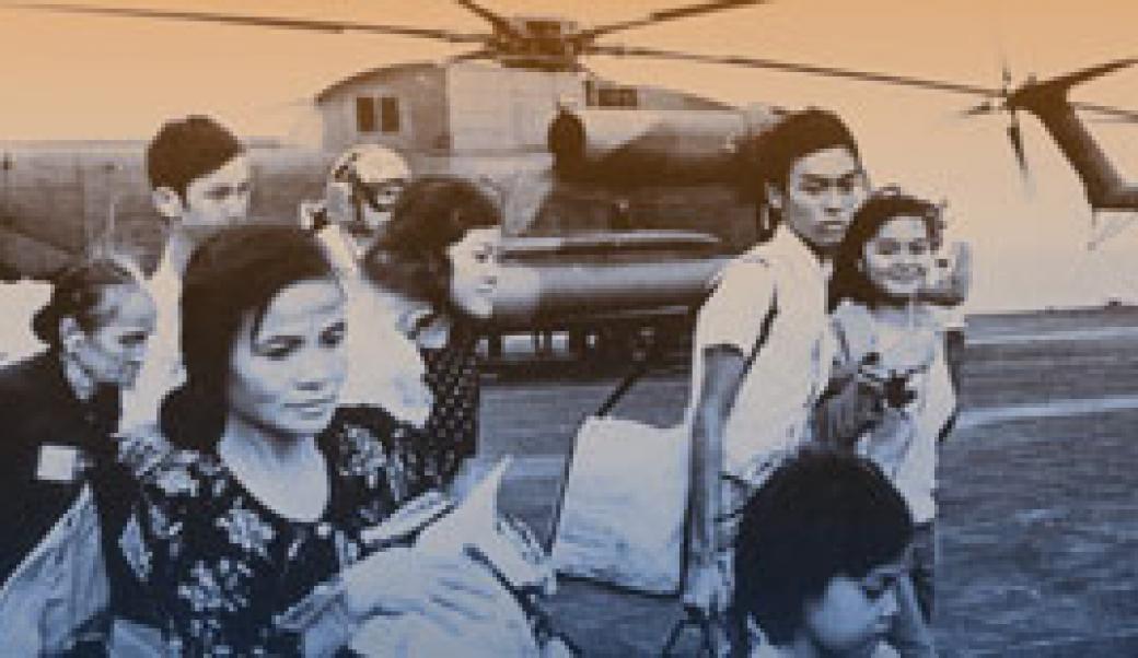 Vietnamese evacuees on board ship helicopter in background
