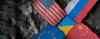 image showing flags of U.S., Russia, China, EU, Ukraine superimposed over camouflage fabric
