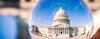 US Capitol seen through a glass globe