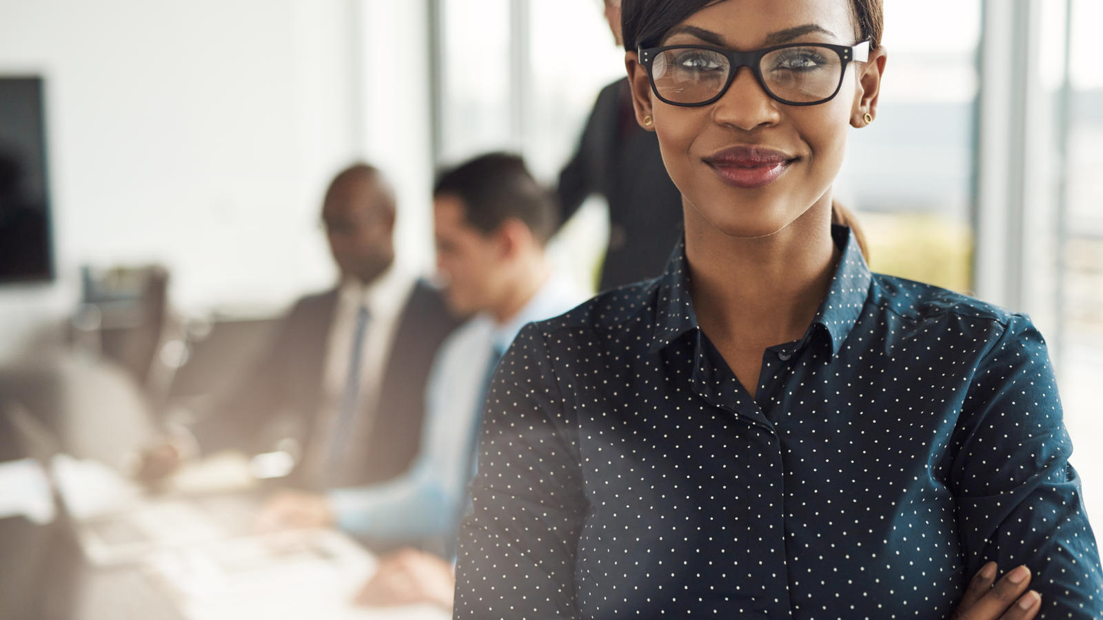 woman standing in office meeting